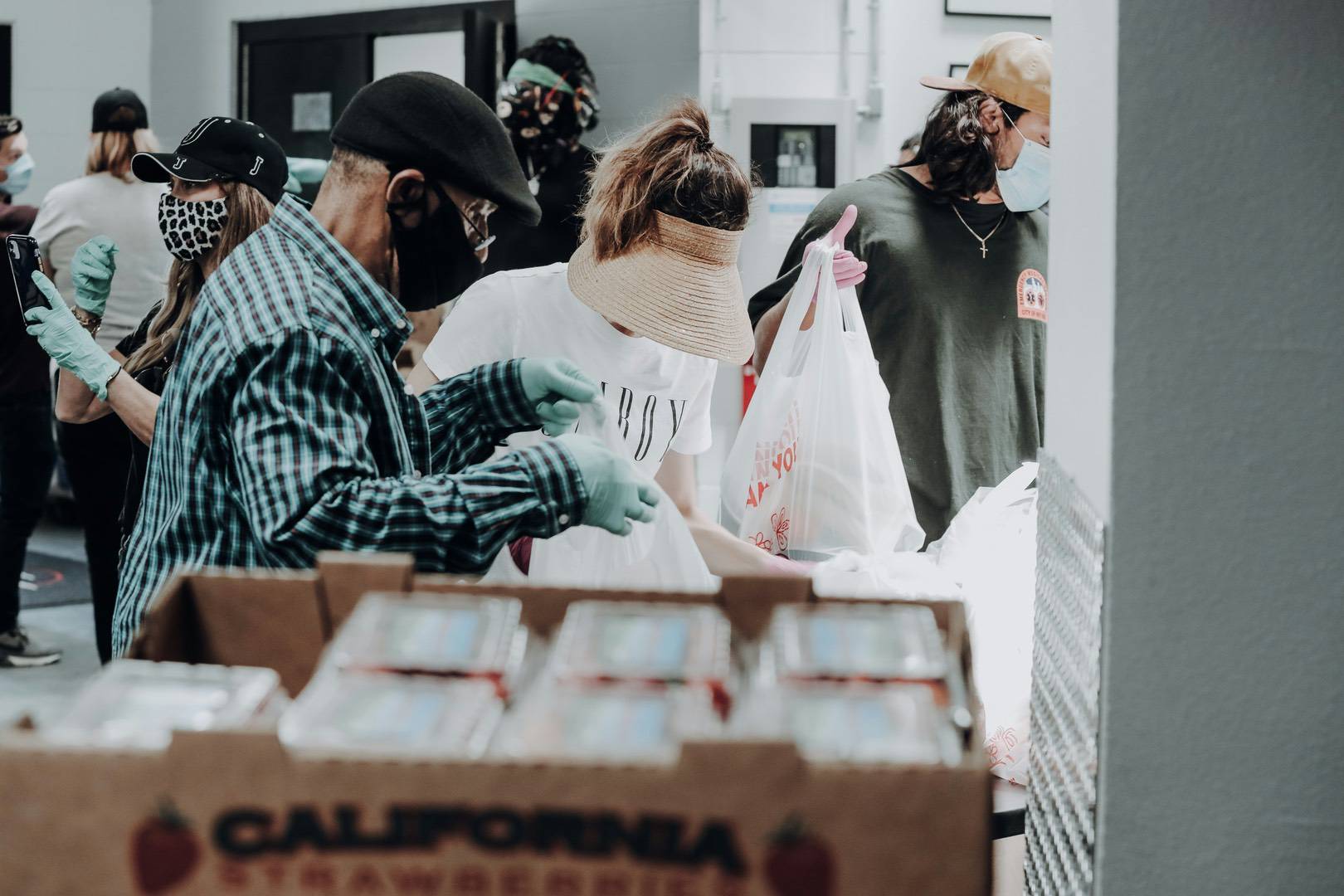 Image of volunteers donating food to food banks